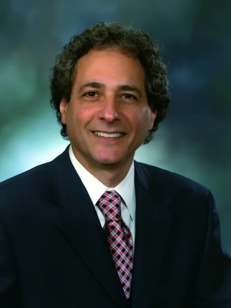 Dr Richard Warshak PhD, author of Divorce Poison, wearing a suite and tie, offers professional services